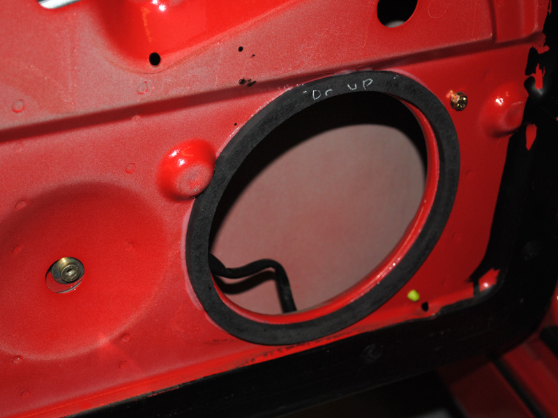 An ABS spacer ring is used to compensate for the uneven door skin. The speaker will be mounted to the metal and needs to sit flat.