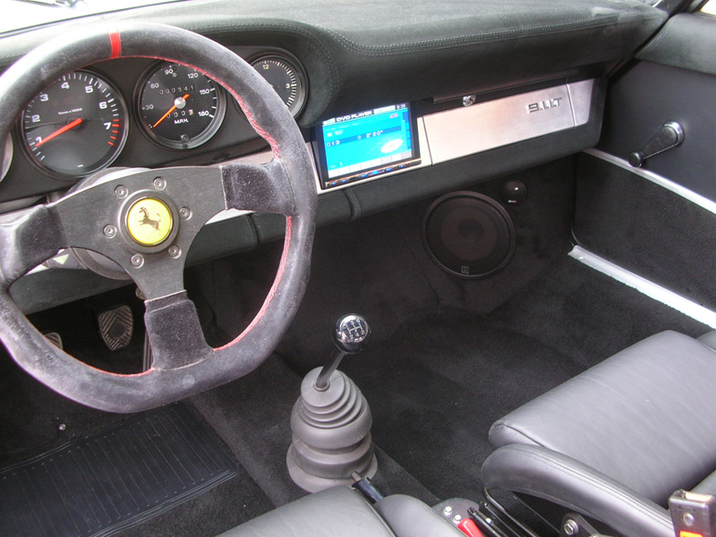 A double DIN radio in an air cooled 911? We have not seen it done, so we decided to take the challenge. This required relocating and rewiring the defroster switch, an auxiliary fan switch and the cigarette lighter. As well as cutting through the firewall, welding a new housing and relocating the windshield wiper motor... "piece of cake"