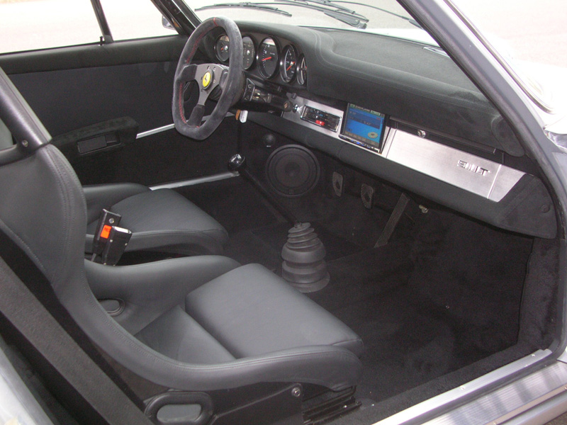 The upper and lower dash was removed and covered in Alcantara suede. All of the dash-trim pieces were hand made out of 3/16" solid aluminum. A brushed finish was applied to go with the classic race car look.