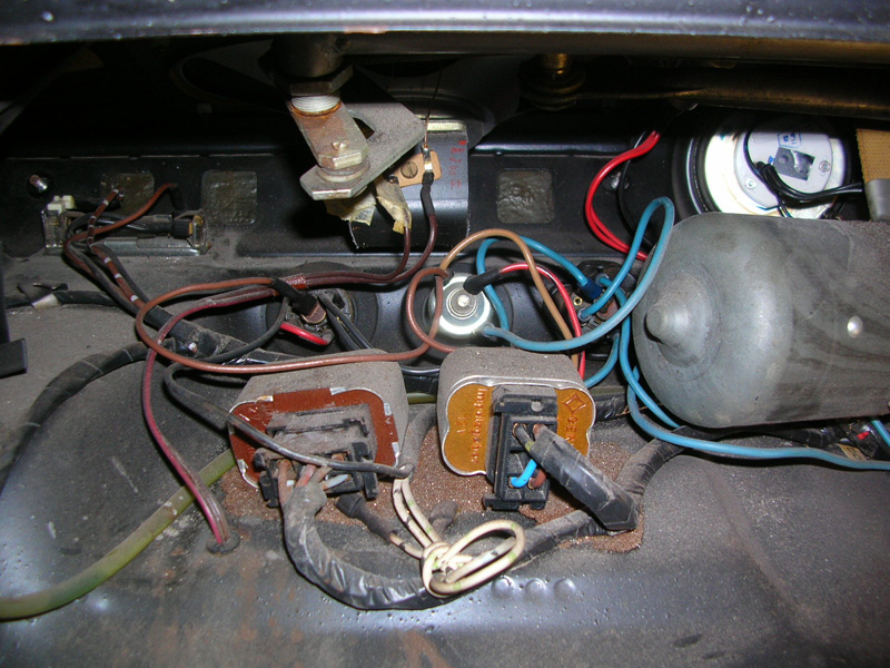 This view is from under the hood, to where the cutout for the new double DIN radio is going to be. Relocating the wiring was easy, but the wiper motor had to be turned 180 degrees to make room.