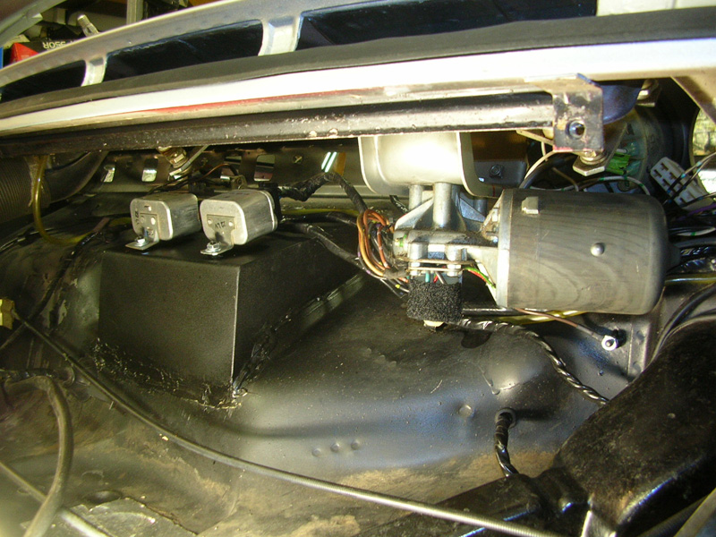 Here you see the relocated wiper motor as well as the new radio housing welded in. The wiring was cleaned up and new mounting studs where welded in for the relays and grounding points.