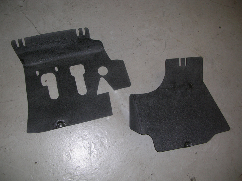 These are two plastic cover panels, made to go into the passenger foot well and around the pedals. They were carpeted with the Porsche carpeting as well.