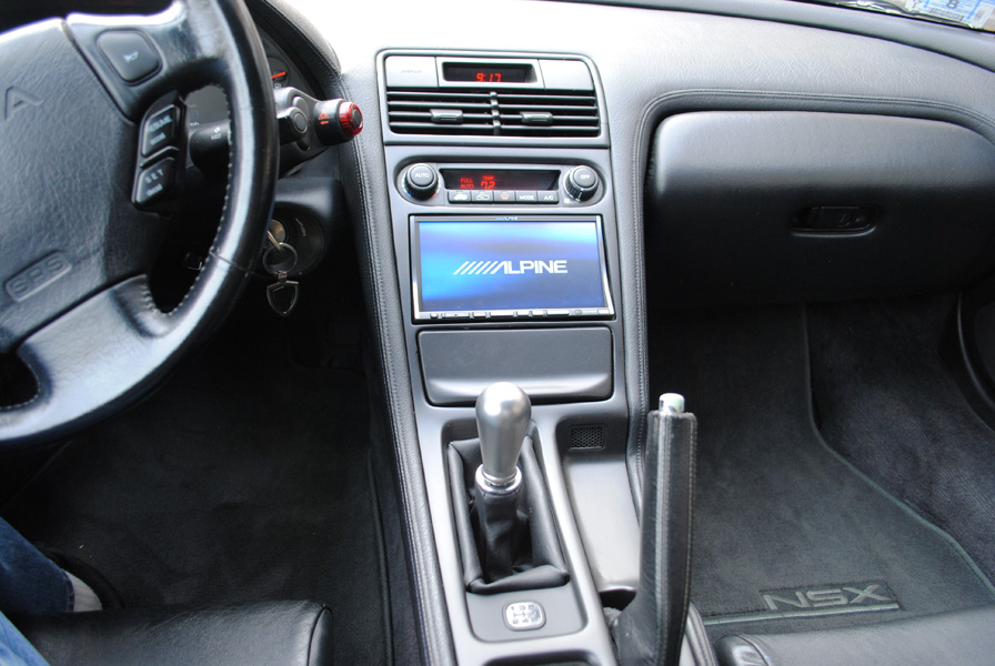 The extensively reworked center console lost its original oval radio and now is home to an Alpine INA-W900.