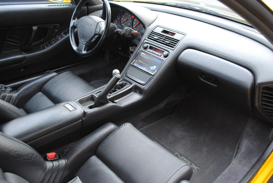 The new touch-screen headunit has GPS Navigation, iPod control and plays CD's, DVD's etc. Also a new pre-made sub enclosure resides under the floor mat in the passenger foot well.
