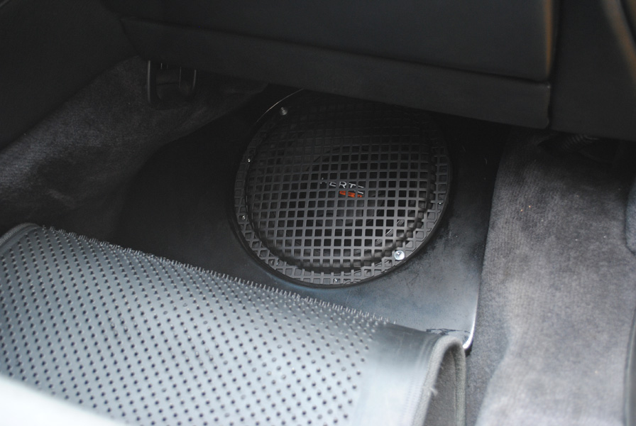 Here is the Hertz 10" subwoofer in a premade enclosure from Science of Speed. We used Dynamat sound deadening material to try and dampen the fiberglass enclosure to get the most out of it.