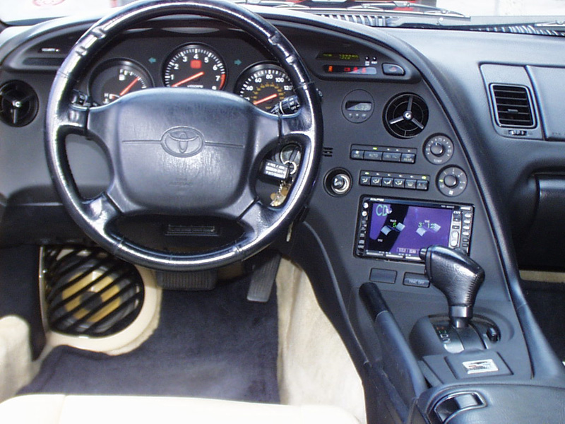 Ergonomics are very important, so the factory steering wheel was stripped of its leather cover and four small buttons were installed at 10 and 2. These now control the radios volume and track controls. The original leather was then reinstalled stitch for stitch.