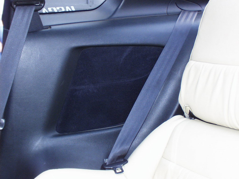 Since the rear speaker locations were horrible for our intentions, we used the space to house two independent Phoenix Gold dual 30 band Equalizers. One on each side of the car. A motorized cover conceals them to look like oversized speaker grilles.