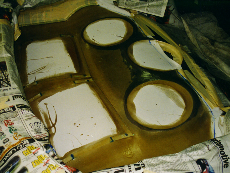 Here you see the cover made out of 1/4" thick fiberglass prior to cutting out the amplifier section.