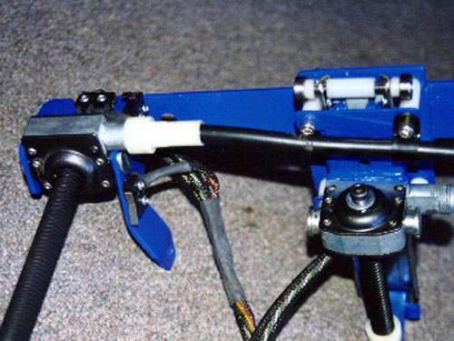 A close-up view shows two of the twelve worm drives used in this install, as well as the ball bearings and limit switches. All the metal brackets were painted regal blue for a cool industrial effect.