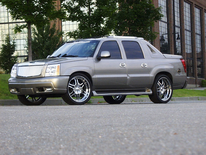 The victim, a 2002 Cadillac Escalade EXT lowered with 24" Symbolic SL10 wheels and custom chrome accents.