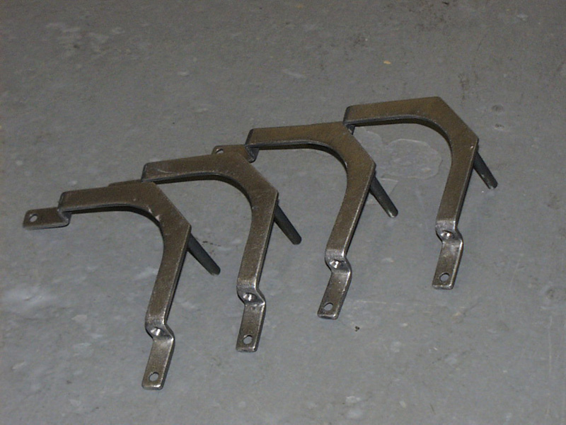 These are the tweeter mounts welded out of steel with two pieces of brake line to allow the wires to run through while doubling as a pressure fit mount.