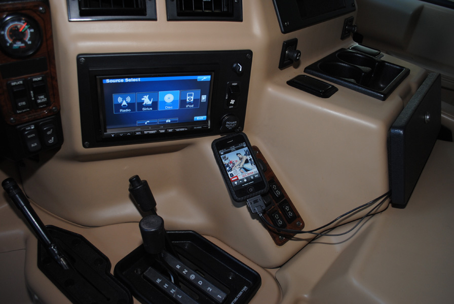 The radio was upgraded to an Alpine INA-W900 double DIN headunit with all the bells and whistles including iPod, Bluetooth and Sirius. A custom mount was made out of 1/4" ABS plastic. It also houses the original fan switch, power outlet and the new bass knob.