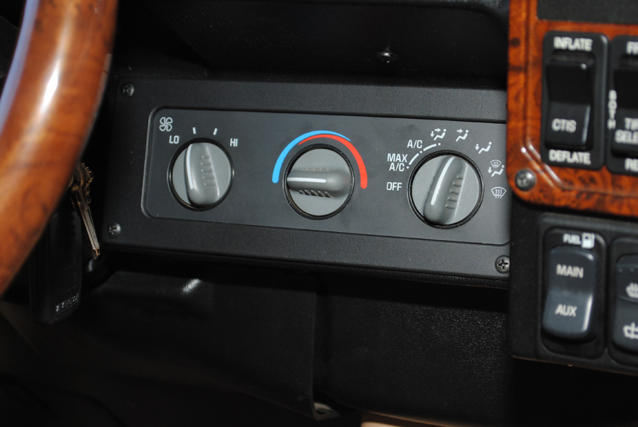 The entire climate control was relocated to the right of the steering wheel. Some re-wiring/re-plumbing had to be done along with a new mount made from ABS plastic.