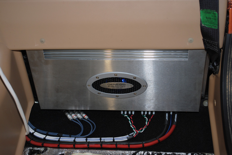 Two Genesis Profile Ultra amplifiers now reside behind each back seat. One two channel on the passenger side powers the two 10" JL Audio 10W3V3 Subs while this four channel on the driver's side powers the six Focal speakers.