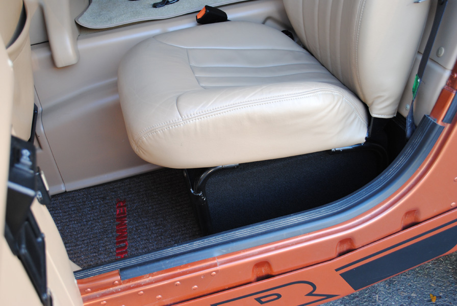 Under each rear seat there now is a custom sealed, down-firing subwoofer enclosure housing a 10" JL Audio 10W3V3 sub. They are suspended up of the floor and mounted to the seat frame.