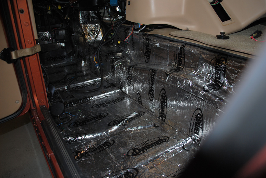 A view of the driver side floor boards and drive train hump with the Dynamat installed.