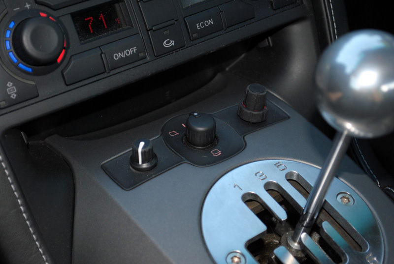 The K-40 control knob was added to the right of the factory power mirror switch, while the Genesis bass control knob was mounted to the left.