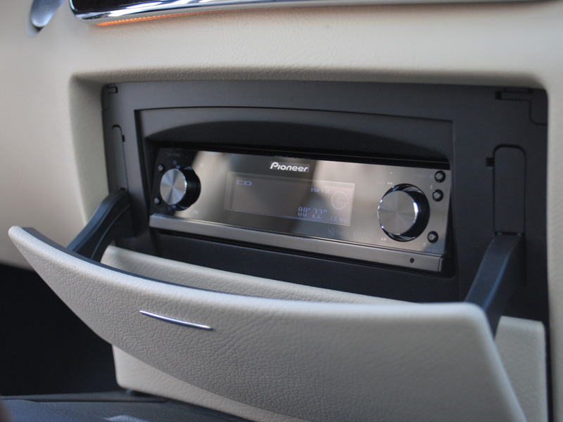 A Pioneer DEX-P99RS was chosen for its clean looks and great DSP. It was installed where the factory CD changer was behind the closable door. The factory radio still functions as well, for the phone, navigation, warning sounds etc.