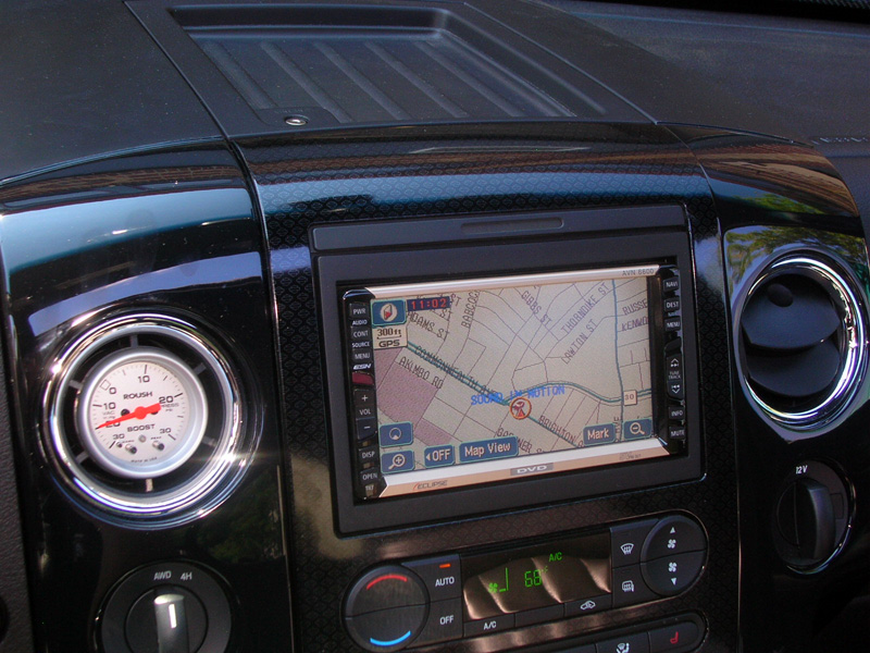 An Eclipse AVN 6600 AM/FM/DVD Navigation unit was chosen for its superior preamp signal, along with its good looks and ergonomics. Check out the boost gauge in the left center vent.