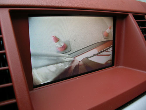 2003 Nissan Murano - We sourced a composite to VGA signal converter to be able to get the signal from the Back-Up Camera onto the factory navigation screen. The cones pictured are actually at the edge of the bumpers.
