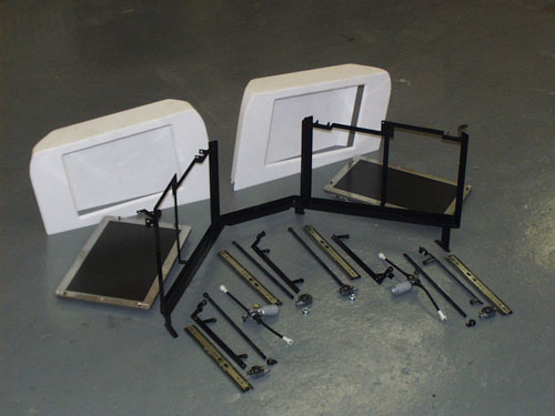 2002 GMC Yukon - A dual motorized TV rack was constructed out of steel using ball bearing tracks and worm drives. The covers for the monitors where made from acrylic and later finished with a black texture.