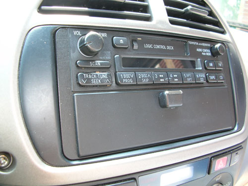 2002 Toyota RAV4 - An old Toyota cassette player along with a cover from a Nissan pocket was used to make this removable cover.