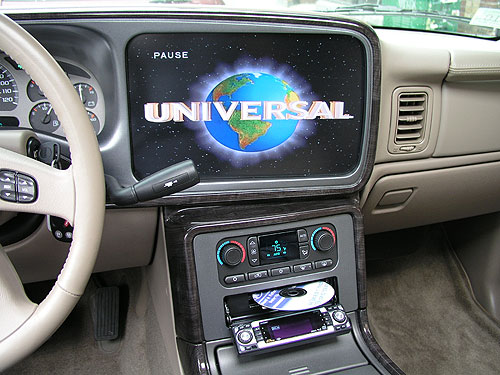 2004 GMC Denali - The original dash bezel was extensively reworked to house this 15" LCD. Thanks to the epoxies and paints available today this is even possible. Blending the metallic dash color was not easy, but the end result was perfect.