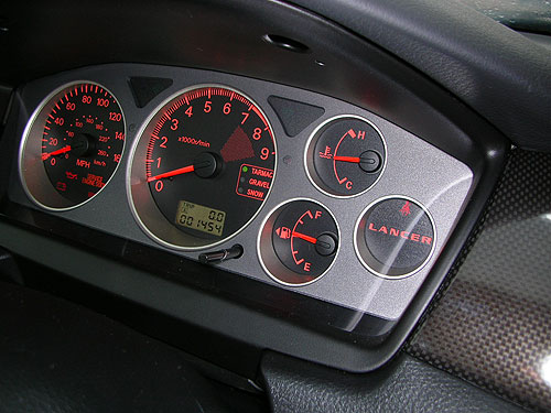 2006 Mitsubishi Lancer - Look closely and you can barely notice the K-40 LED's in this silver instrument cluster. We dusted the top of them with silver paint to blend in for a stealth look.